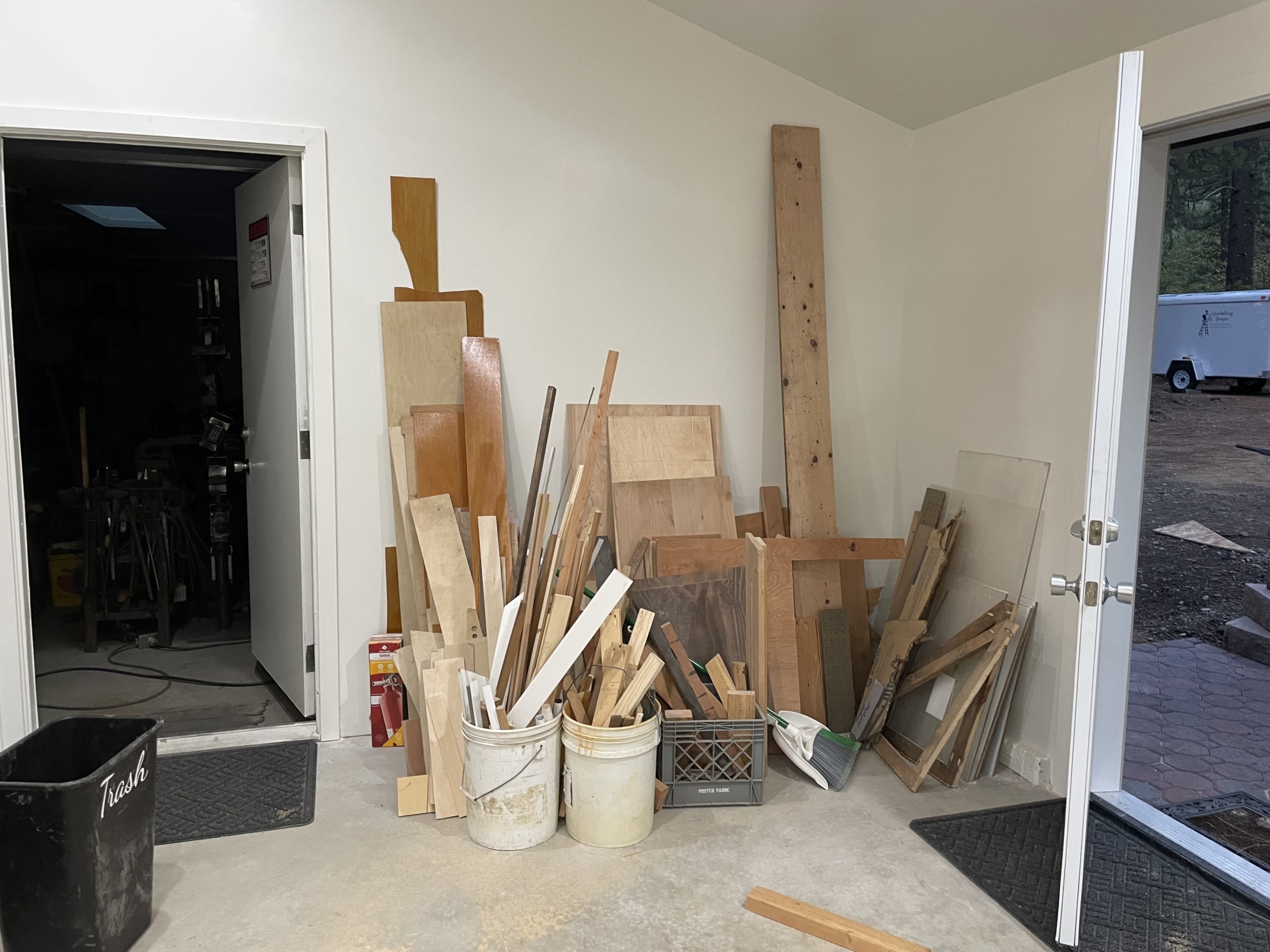 Before photo of the messy scrap wood area in my new shop.