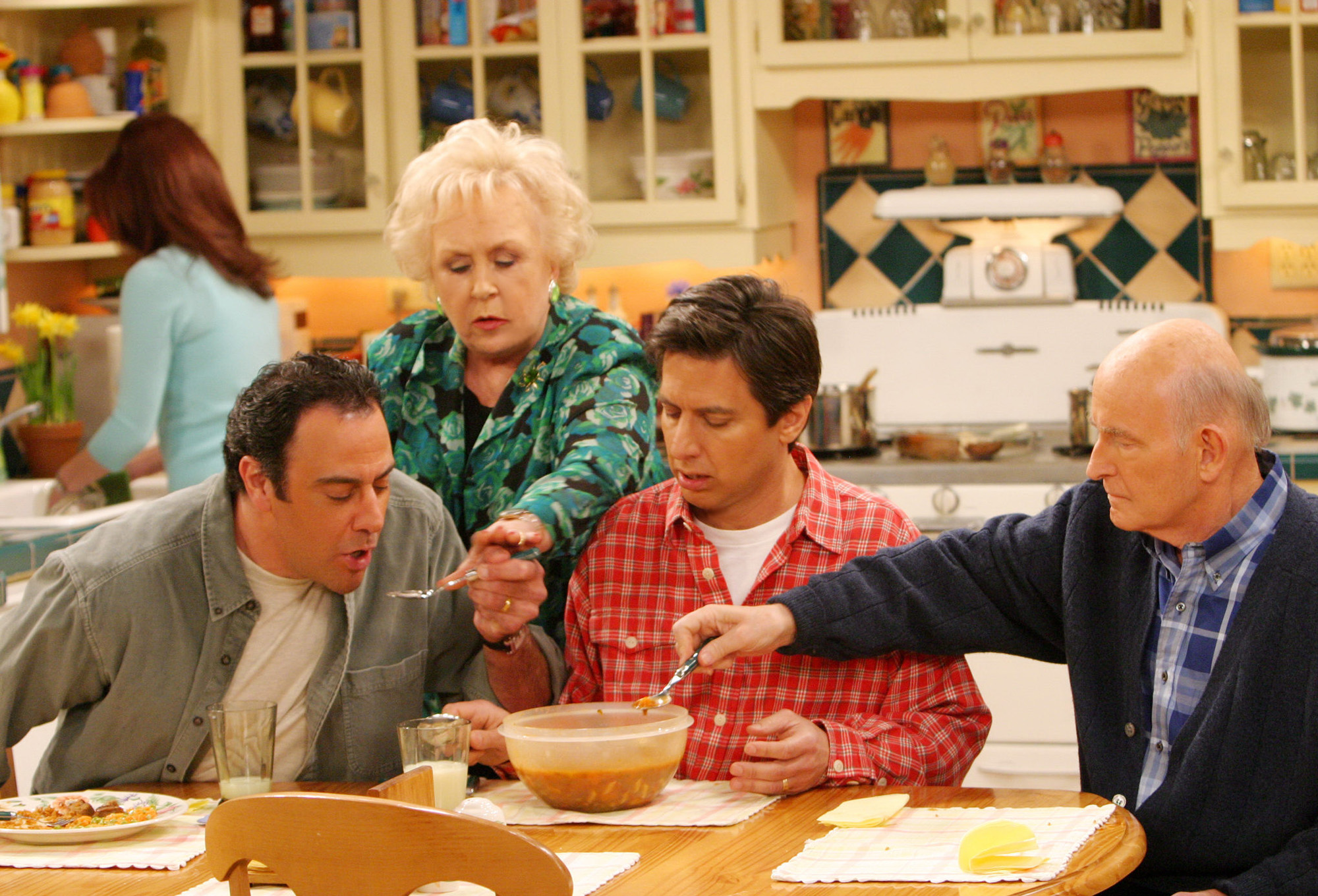 LOS ANGELES - APRIL 16:  Marie takes care of the three men in her life on the May 16 series finale of EVERYBODY LOVES RAYMOND.  From left to right:  Brad Garrett, Doris Roberts, Ray Romano, Peter Boyle.  Patricia Heaton featured in background.  (Photo by Robert Voets/CBS Photo Archive/Getty Images)